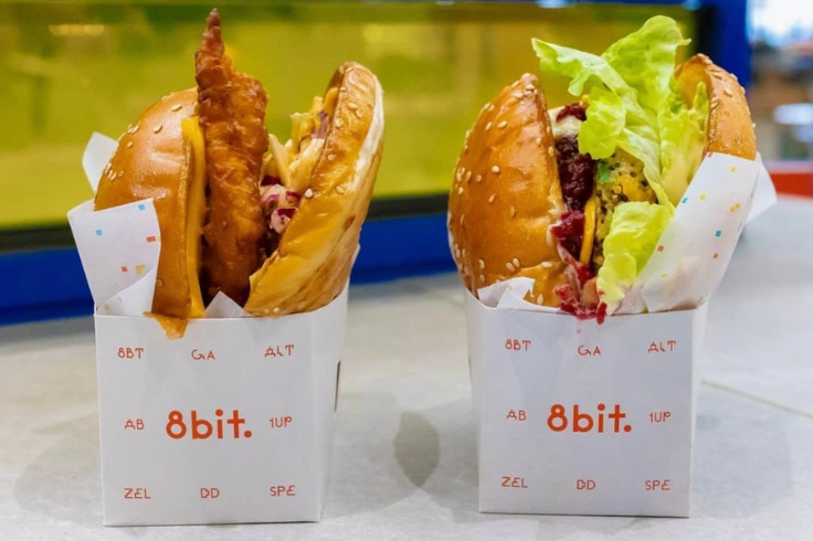 Two burgers in cardboard boxes