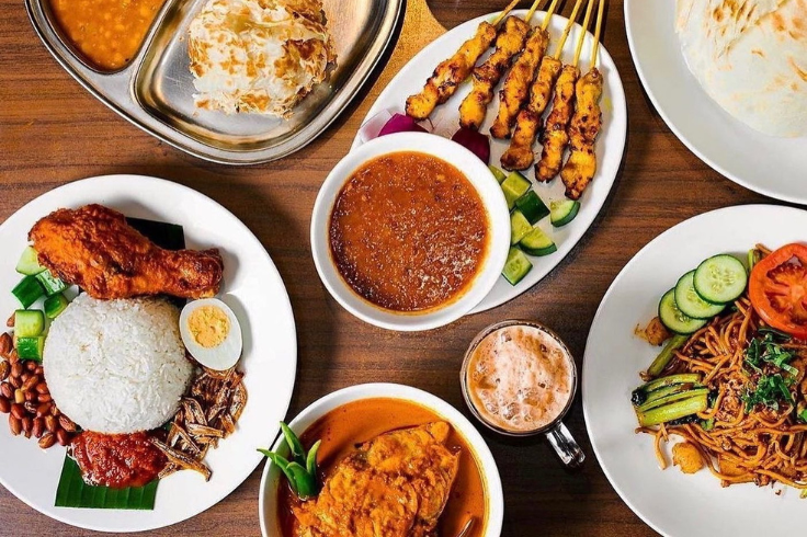 Table spread of Malaysian dishes