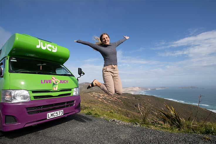 Cape Reinga lookout behind JUCY campervan