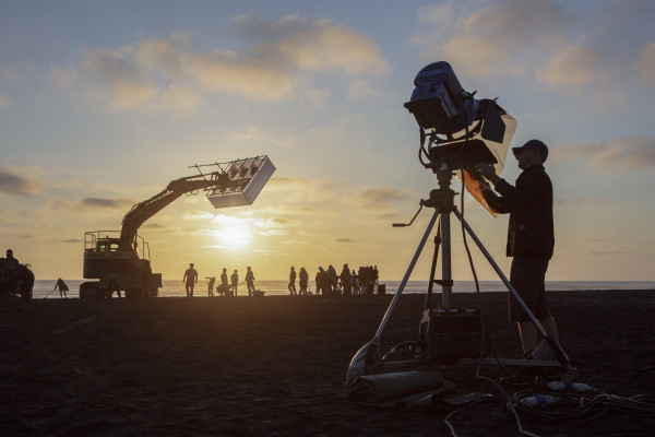 Crew on film set at night-time