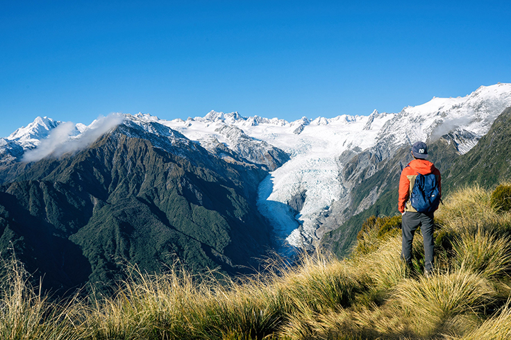 Man hiking through mountains