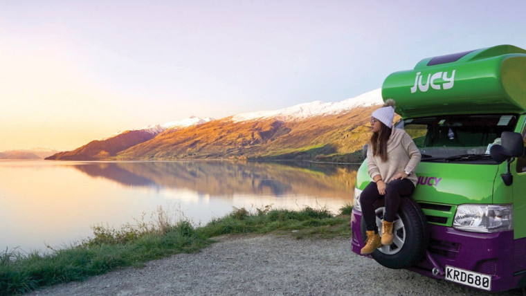 condo-girl-stares-out-at-lake