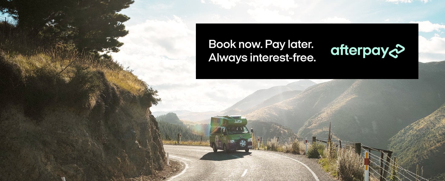 JUCY Campervan on the road with Afterpay, Book Now Pay Later logo