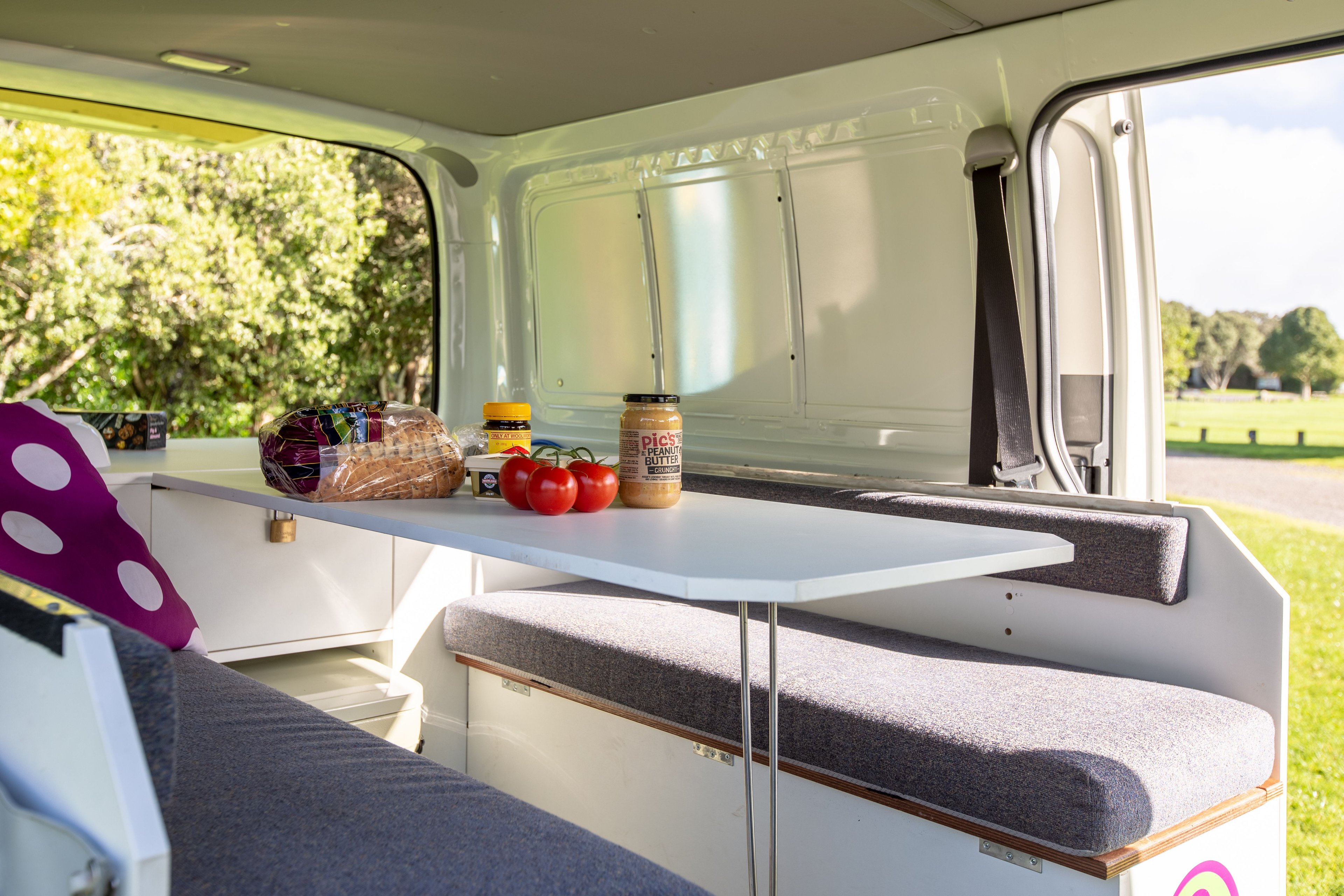 Internal table of the Malibu Campervan with condiments and vegitables